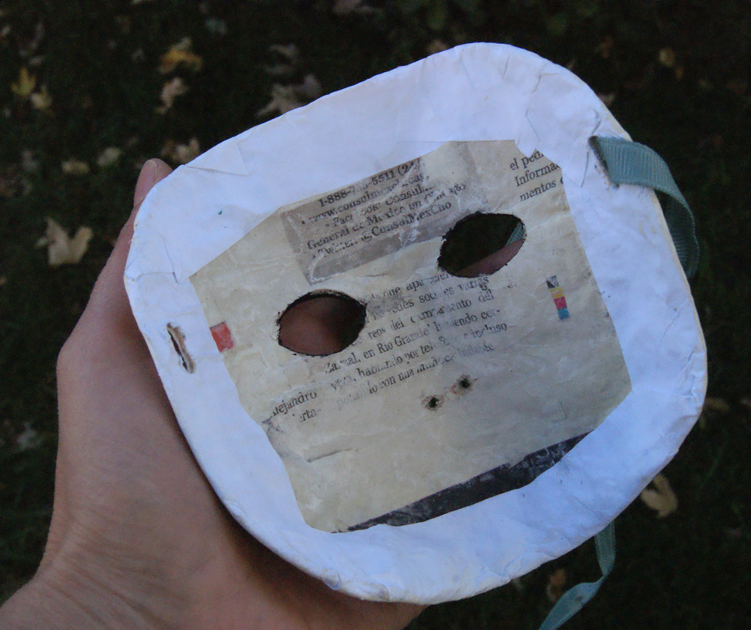 backside of papier-mache mask